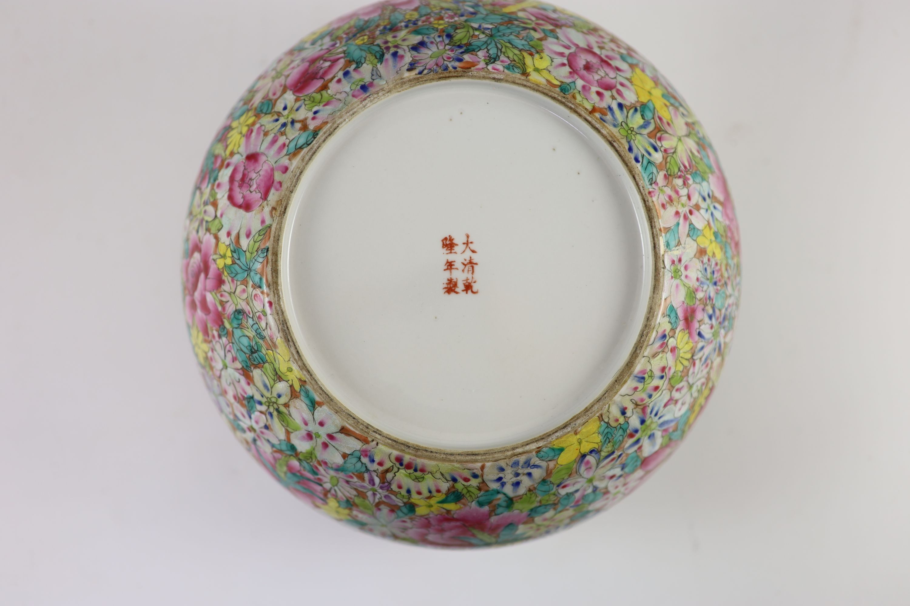 A near pair of Chinese famille rose’millefleur’ dishes and a similar alms bowl, Republic period, Dishes 32.5 and 33.5 cm diameter, bowl 24 cm diameter